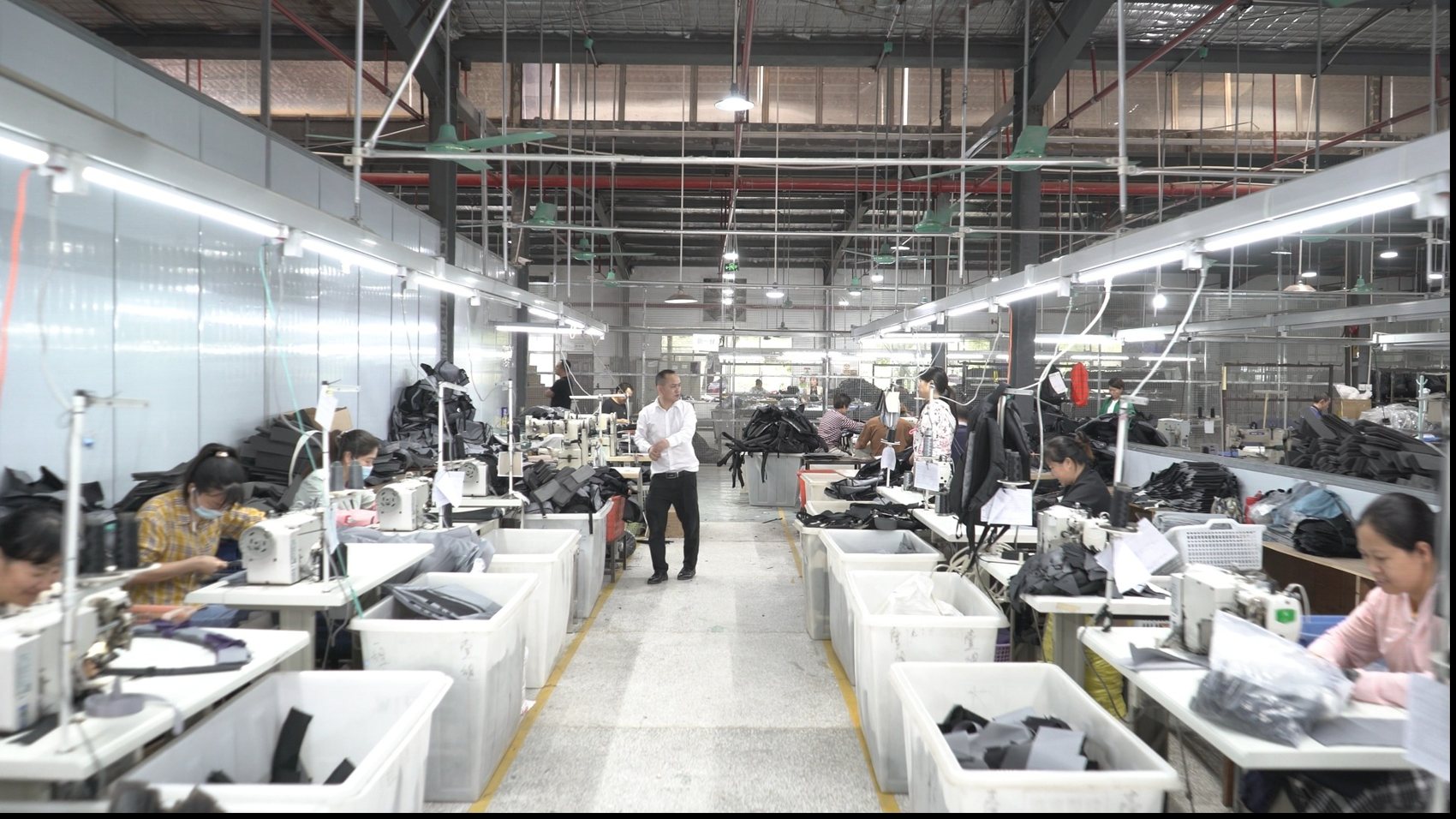 Workers at sewing machines in the C.YOU factory